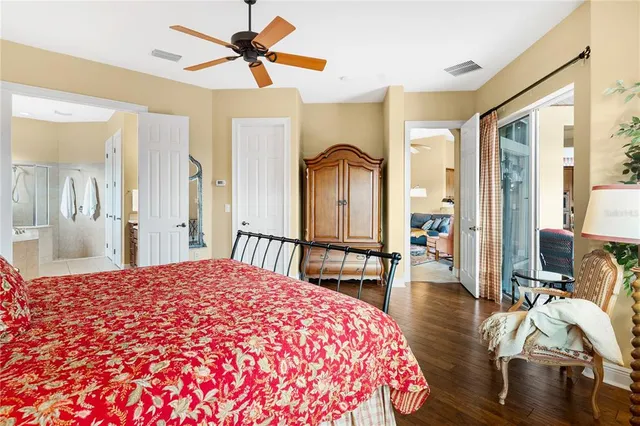 a bedroom with a bed and a chandelier