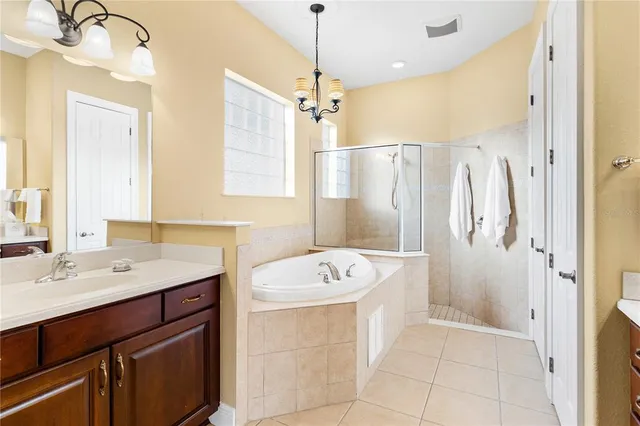 a bathroom with a sink mirror and a toilet
