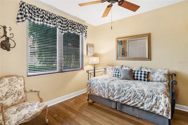 a view of a swimming pool with outdoor seating and plants