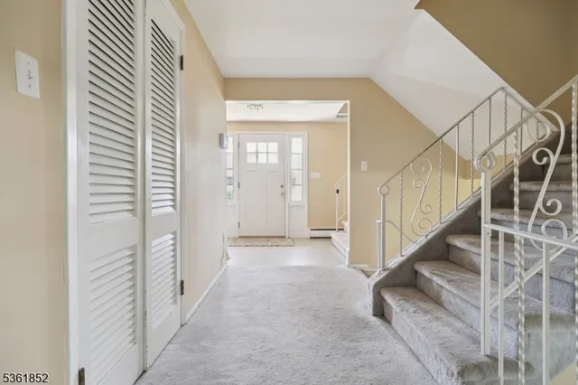a view of a hallway with staircase