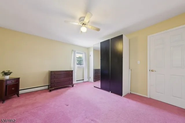a view of an empty room with closet area