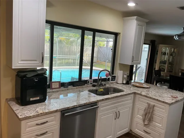 a kitchen with a sink and a window