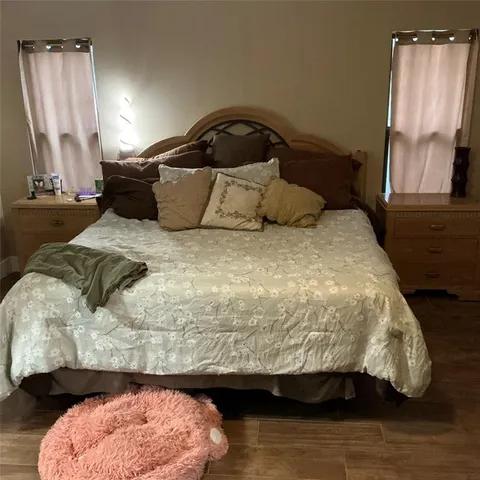 a bedroom with a bed and window