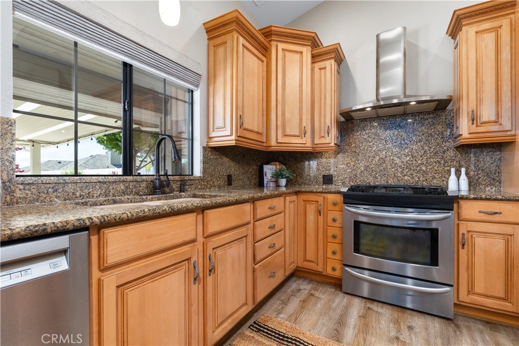 1275 Shane Lane Templeton, CA 93465 - Photo 14 of 70 a kitchen with stainless steel appliances granite countertop a sink a stove and cabinets