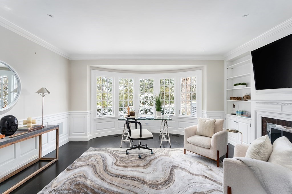 35 Wykeham Road Newton, MA 02465 - Photo 12 of 40 a living room with furniture a fireplace and a flat screen tv