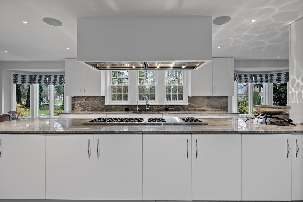 35 Wykeham Road Newton, MA 02465 - Photo 15 of 40 a kitchen with granite countertop a sink and white cabinets
