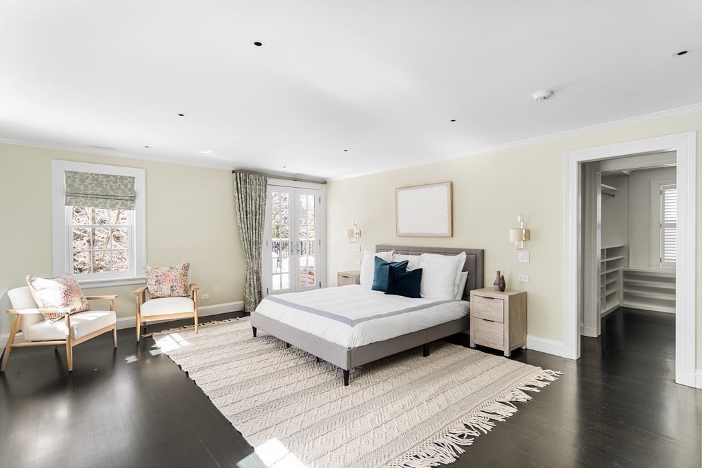 35 Wykeham Road Newton, MA 02465 - Photo 22 of 40 a spacious bedroom with a bed lamp and a large window