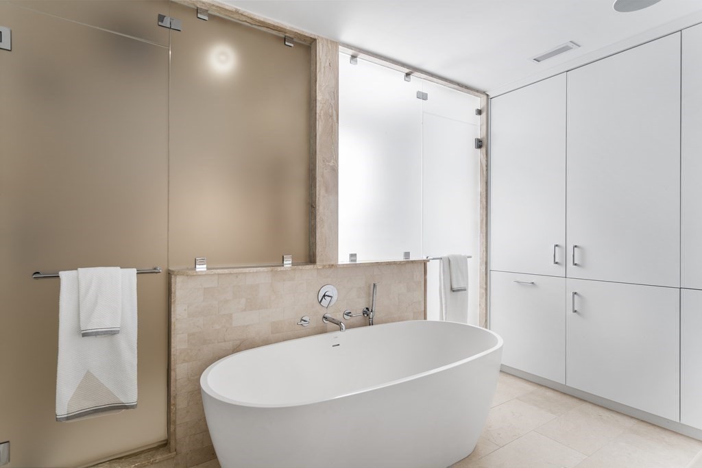 35 Wykeham Road Newton, MA 02465 - Photo 25 of 40 a white bath tub sitting in a bathroom