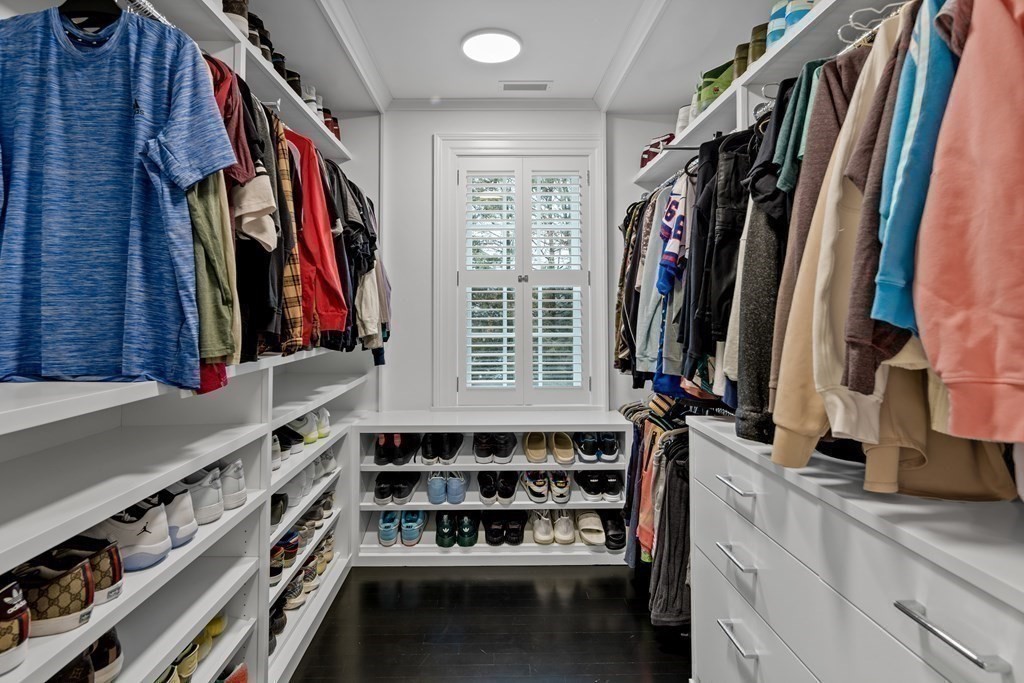 35 Wykeham Road Newton, MA 02465 - Photo 26 of 40 a view of walk in closet with clothes and shoes