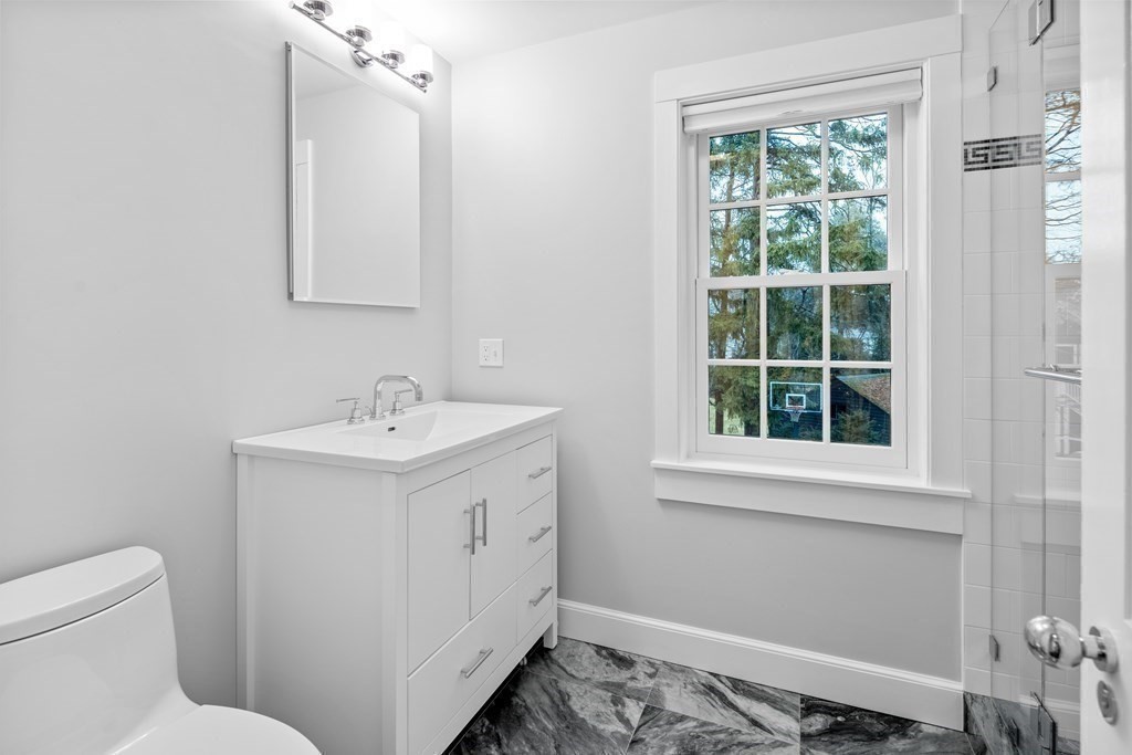 35 Wykeham Road Newton, MA 02465 - Photo 31 of 40 a bathroom with a sink and a toilet