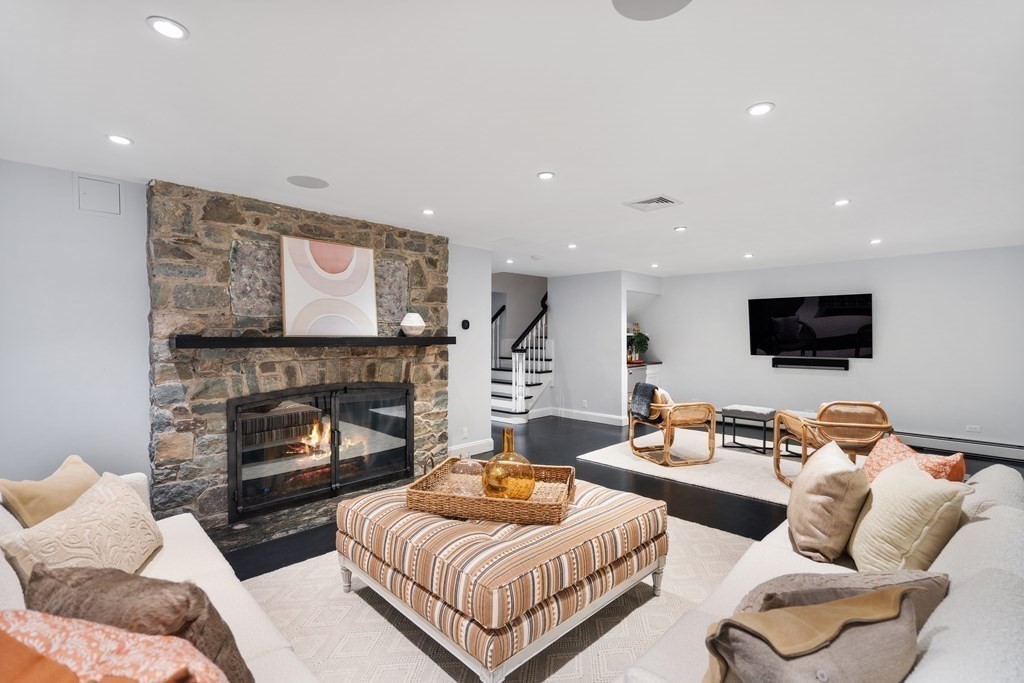 35 Wykeham Road Newton, MA 02465 - Photo 34 of 40 a living room with furniture and a fireplace