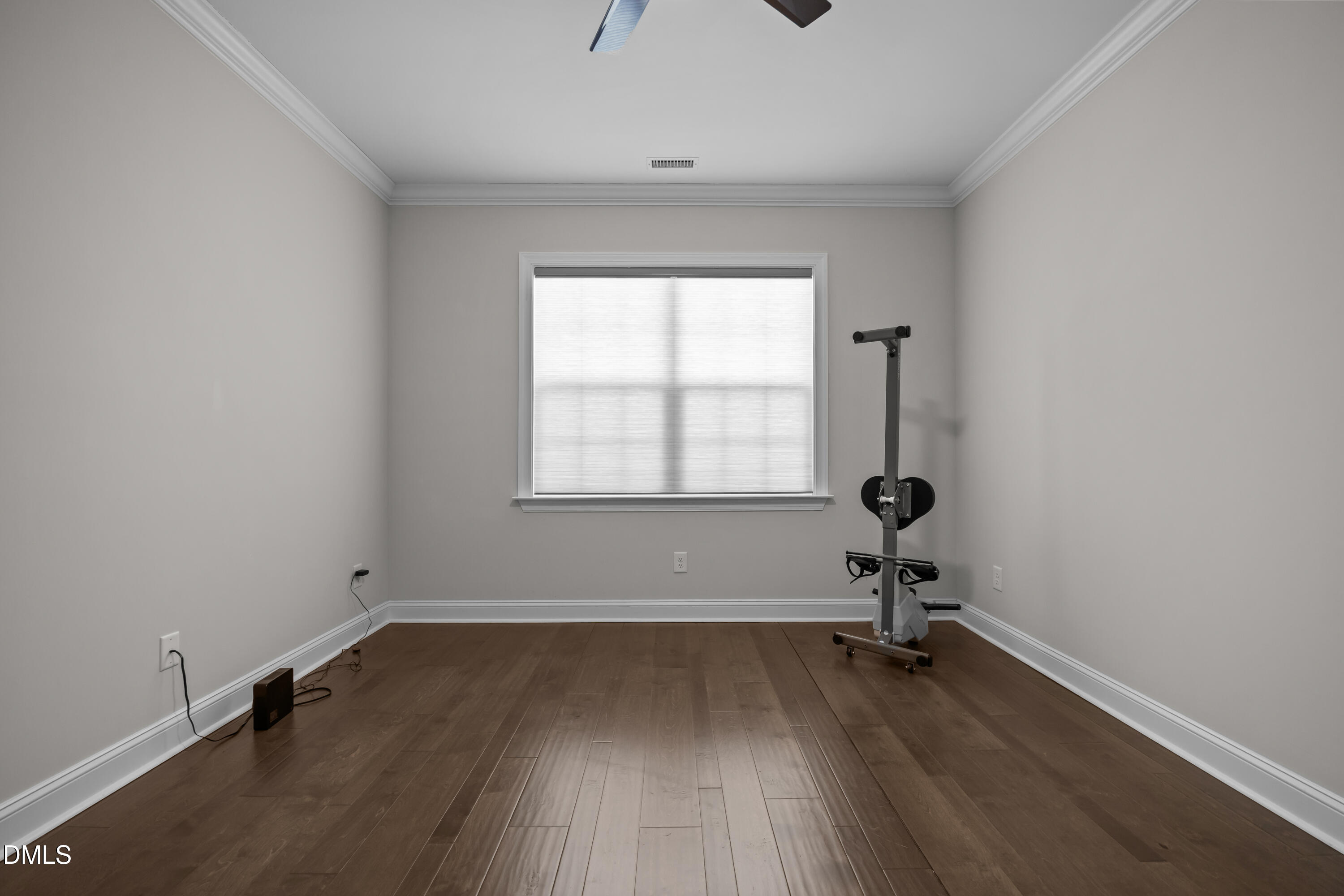 226 English Violet Lane Raleigh, NC 27610 - Photo 11 of 34 an empty room with a window and wooden floor
