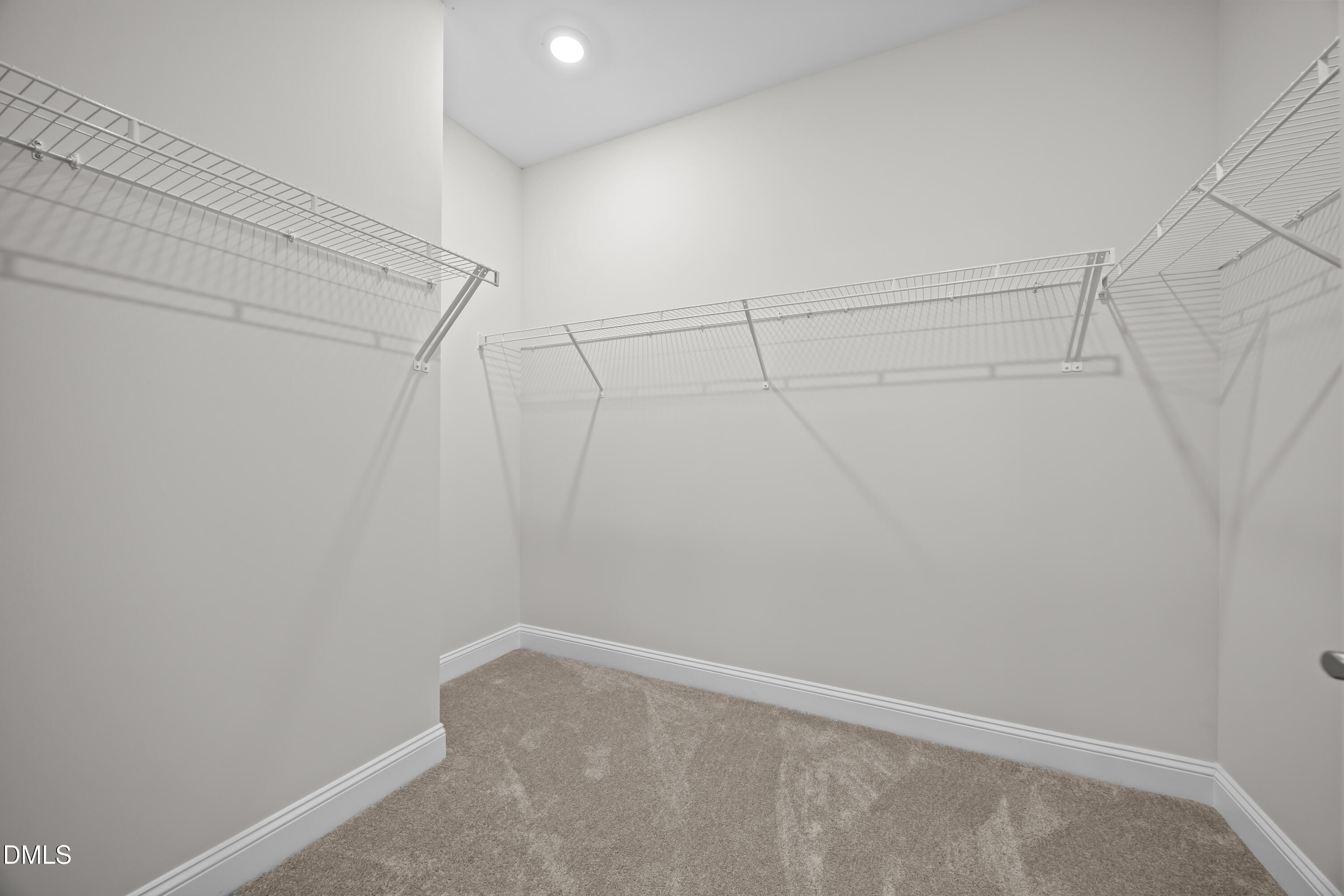 226 English Violet Lane Raleigh, NC 27610 - Photo 16 of 34 a view of a room with racks on the wall