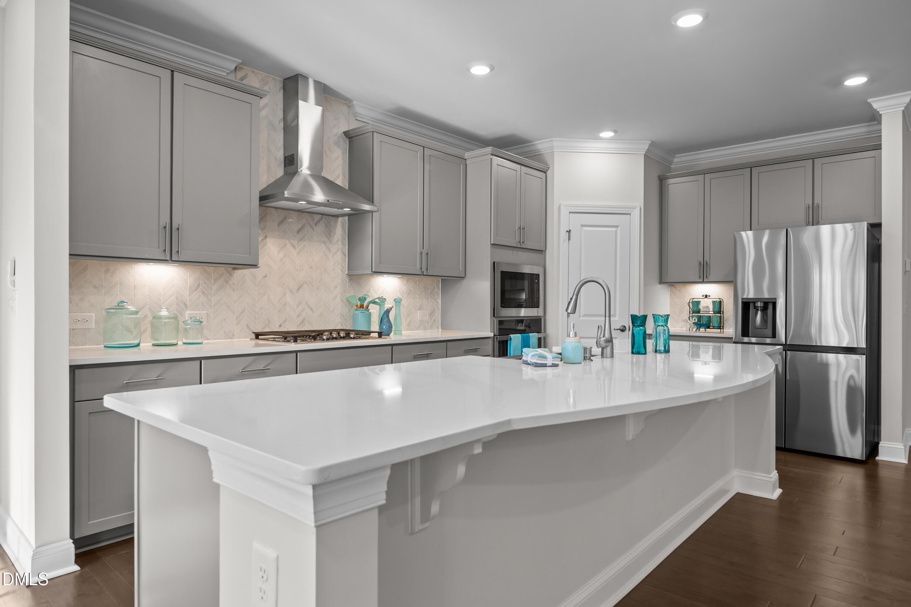 226 English Violet Lane Raleigh, NC 27610 - Photo 19 of 34 a kitchen with stainless steel appliances a refrigerator a sink and a stove