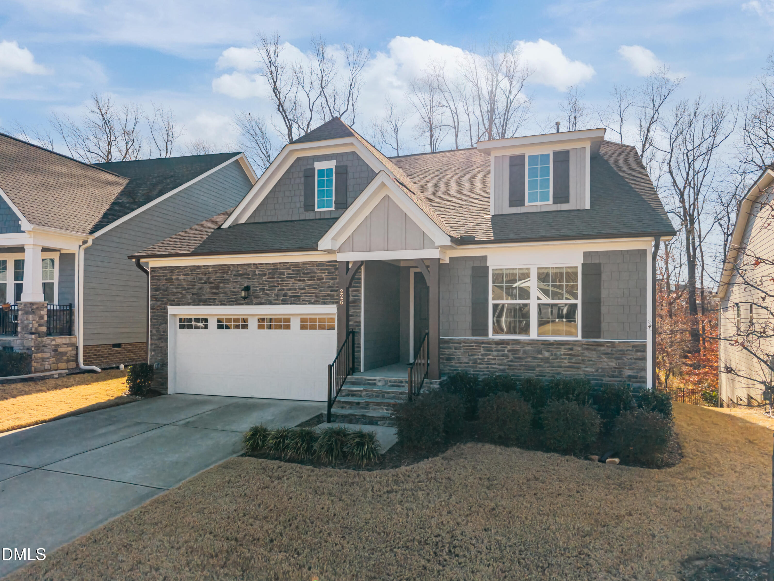 226 English Violet Lane Raleigh, NC 27610 - Photo 2 of 34 a front view of a house with a yard and garage