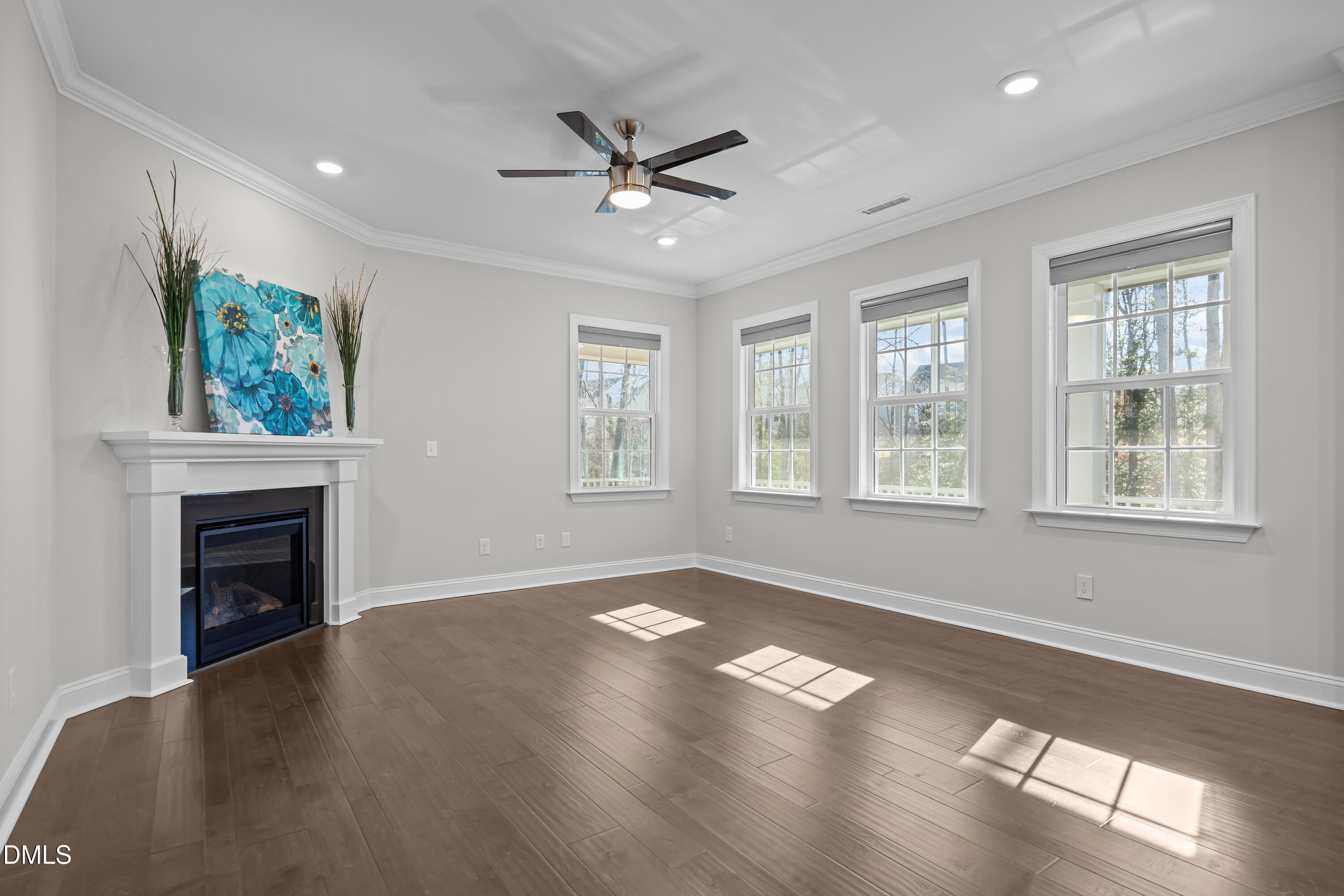 226 English Violet Lane Raleigh, NC 27610 - Photo 21 of 34 a view of an empty room with window and wooden floor