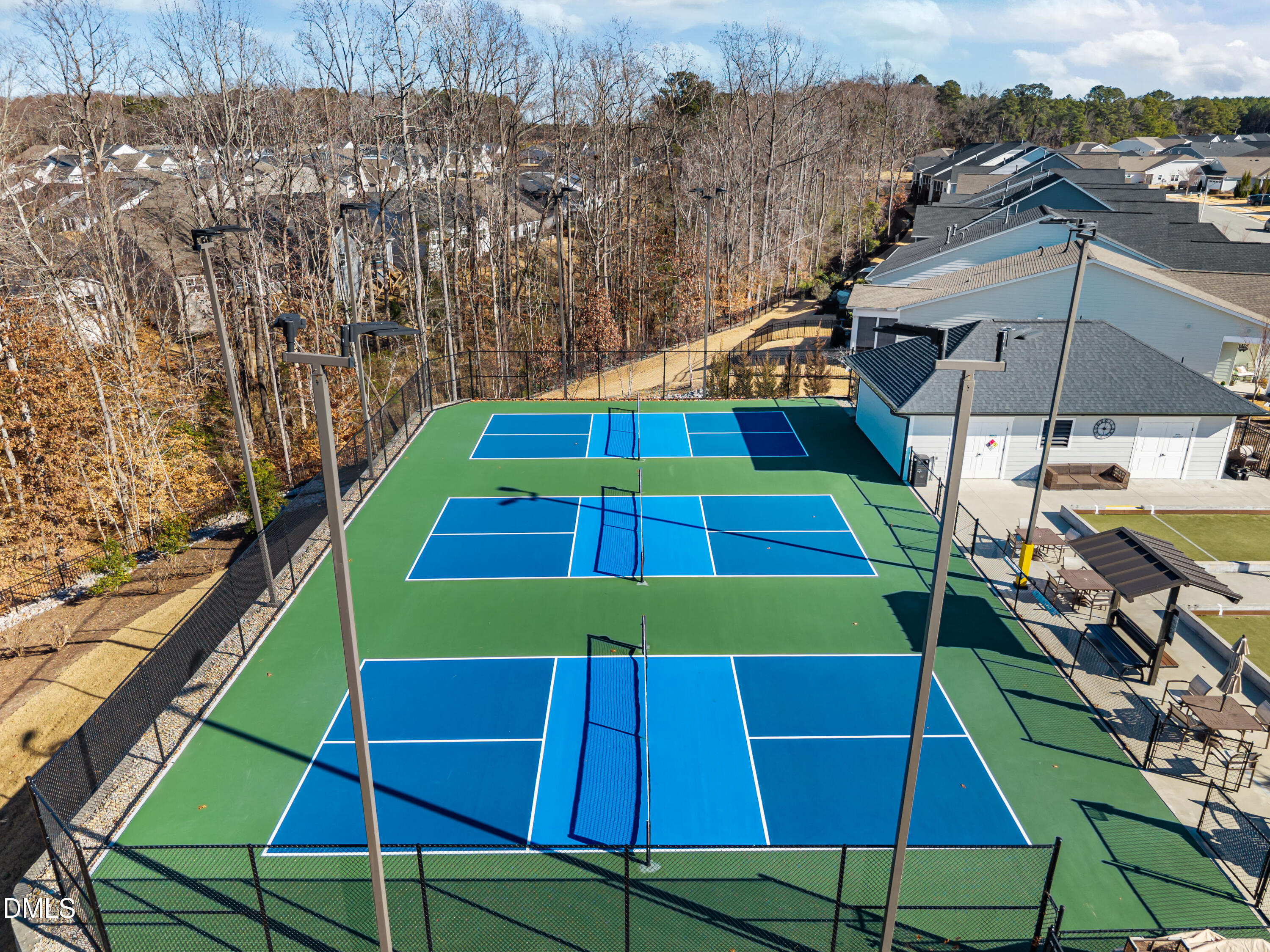 226 English Violet Lane Raleigh, NC 27610 - Photo 32 of 34 a view of a tennis ground with large trees