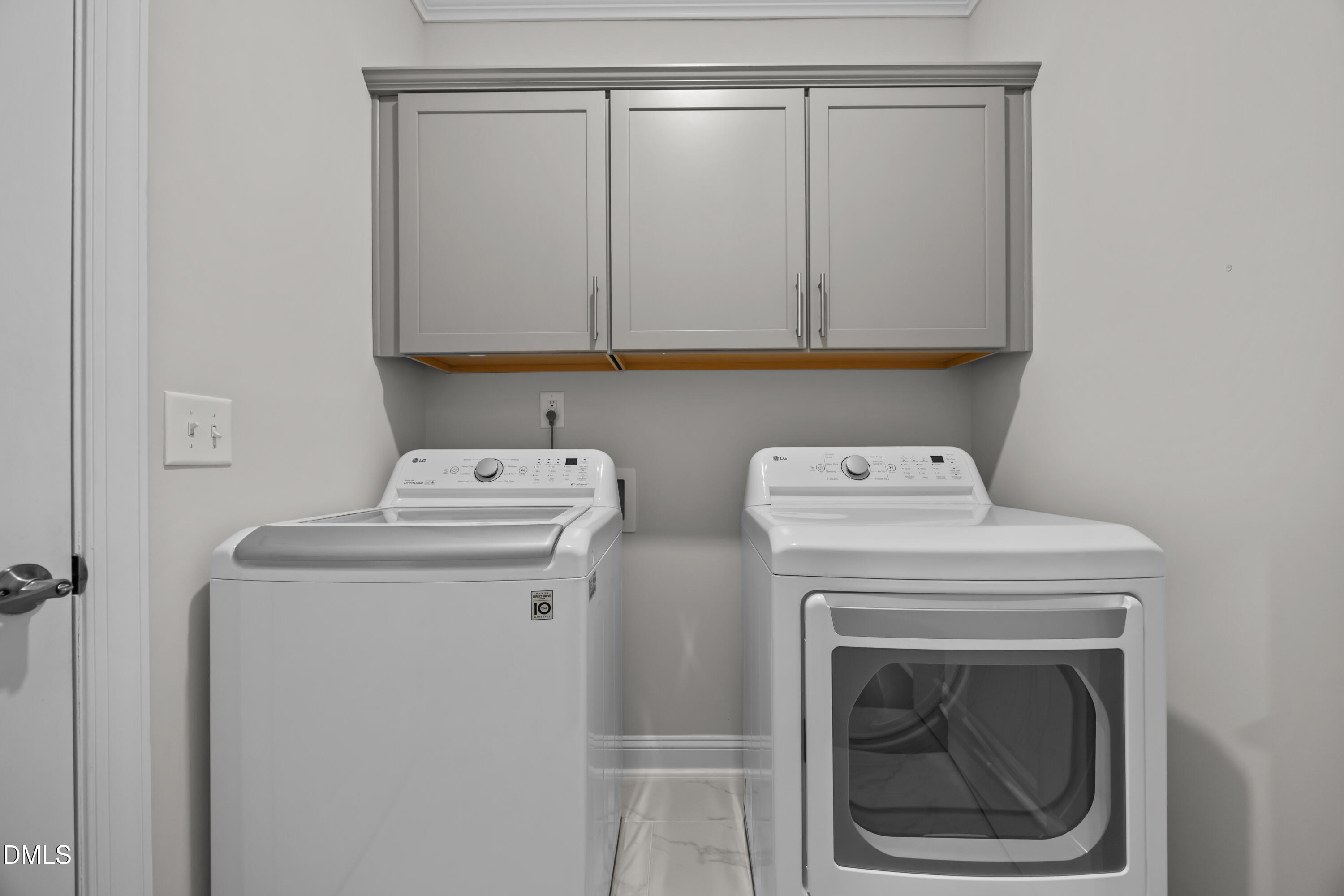226 English Violet Lane Raleigh, NC 27610 - Photo 9 of 34 a utility room with dryer and washer