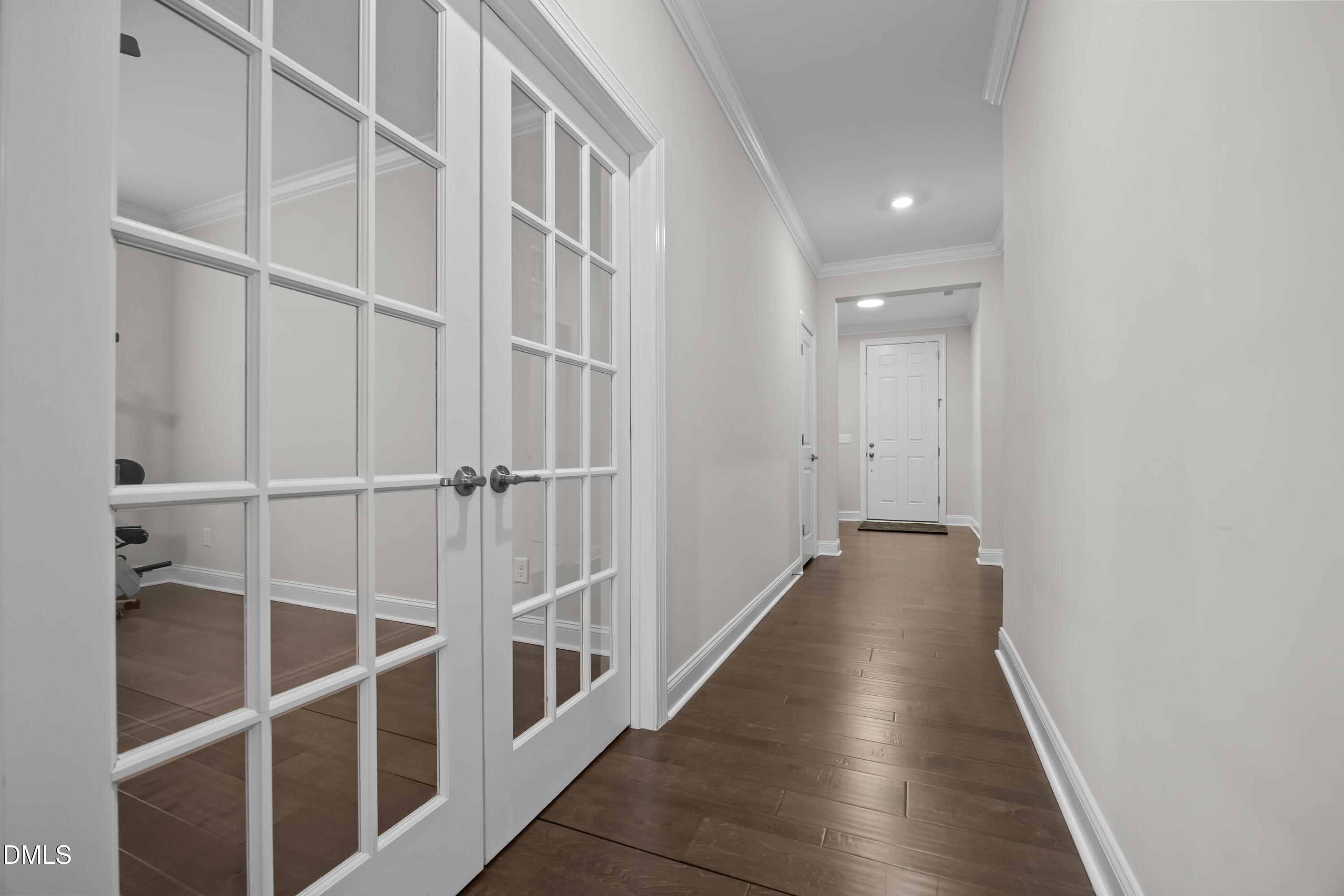 226 English Violet Lane Raleigh, NC 27610 - Photo 10 of 34 a view of a hallway with wooden floor and entryway