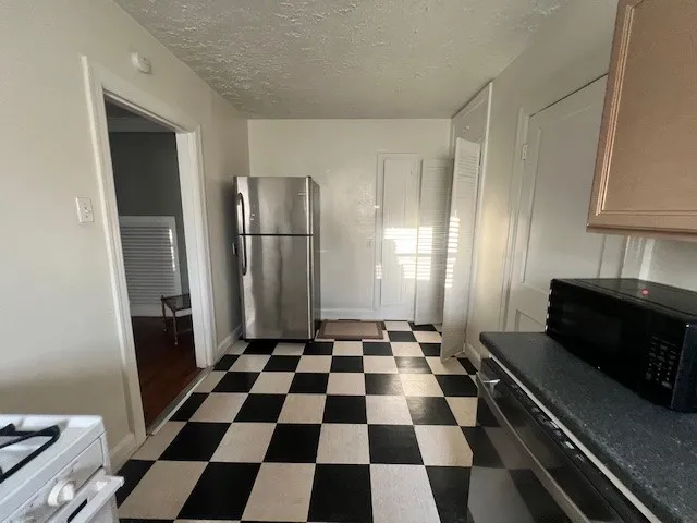 a black and white checkered floor with a black white checkered floor