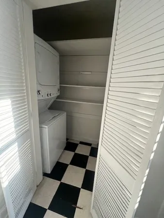a bathroom with a sink a toilet and a window