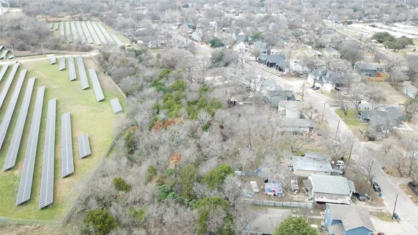 a aerial view of a residential apartment building with a yard
