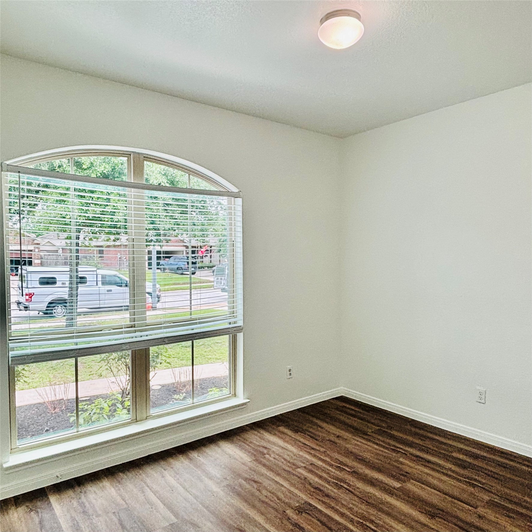 22480 Toronado Ridge Lane Porter, TX 77365 - Photo 19 of 42 an empty room with wooden floor and windows