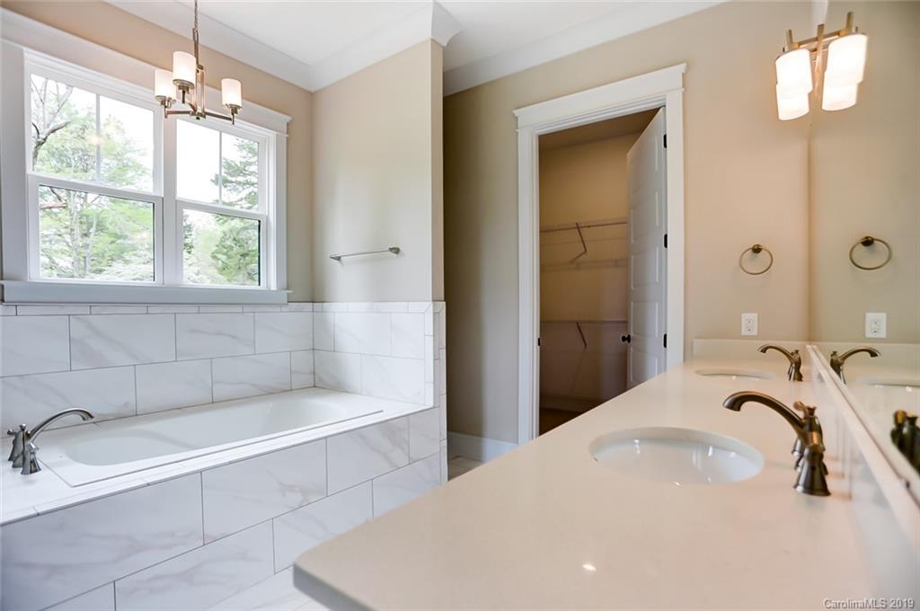 846 Union New Hope Road Gastonia, NC 28056 - Photo 21 of 41 a bathroom with a tub a sink and a window
