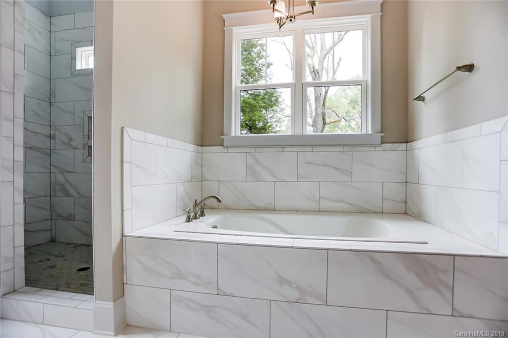 846 Union New Hope Road Gastonia, NC 28056 - Photo 22 of 41 a bathroom with a bathtub and shower