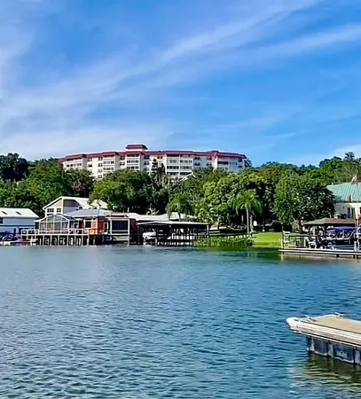 an aerial view of a house with a lake view