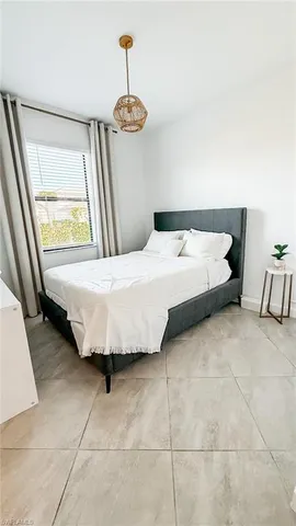 a bedroom with a bed and a table