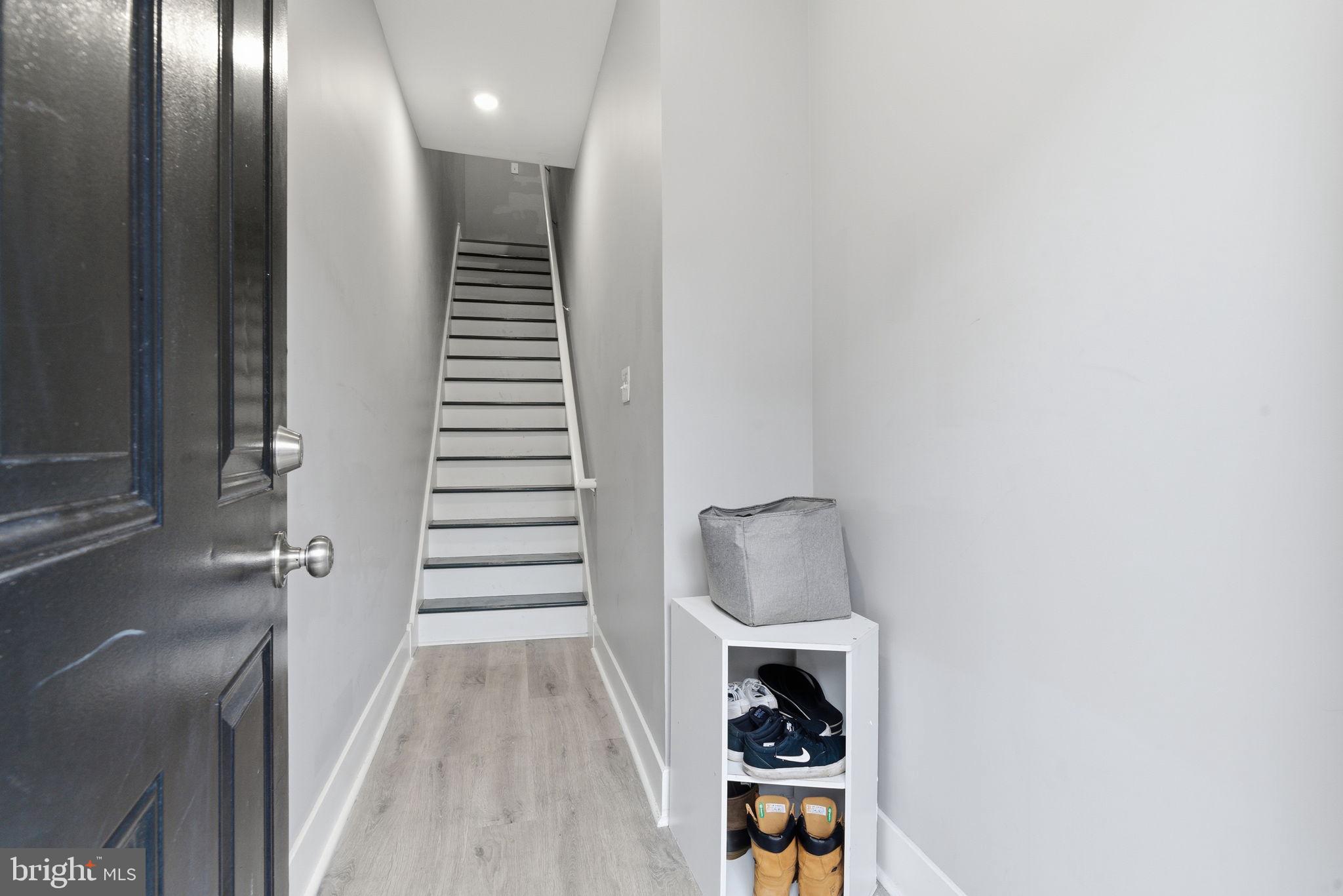 1813 South 23rd Street Philadelphia, PA 19145 - Photo 12 of 23 a view of a hallway with stairs and a window