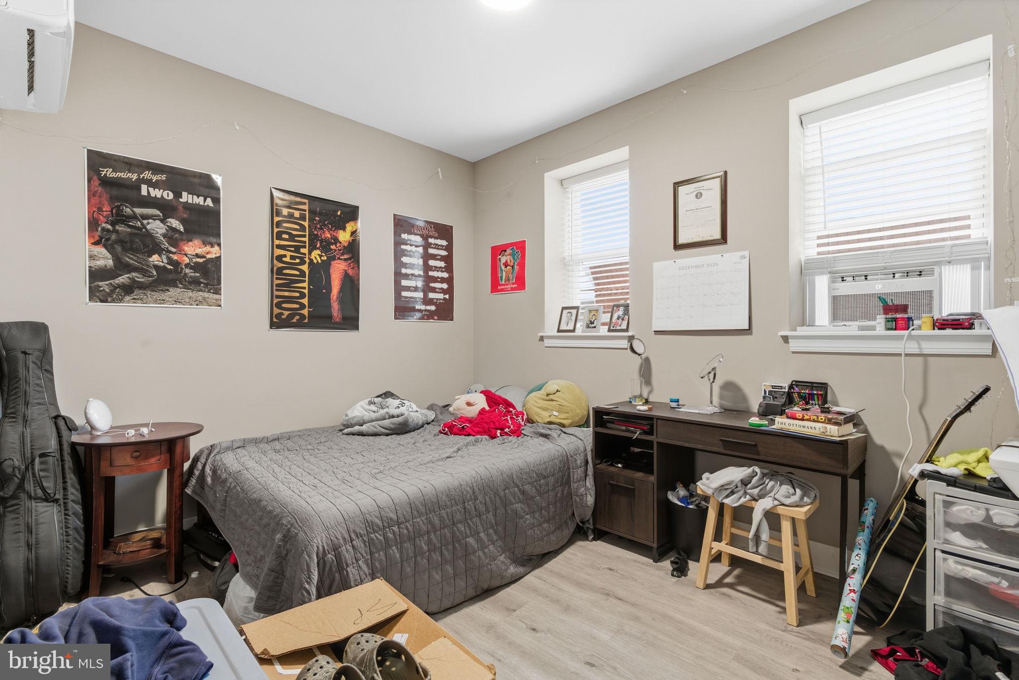1813 South 23rd Street Philadelphia, PA 19145 - Photo 16 of 23 a bedroom with a bed and a table in it