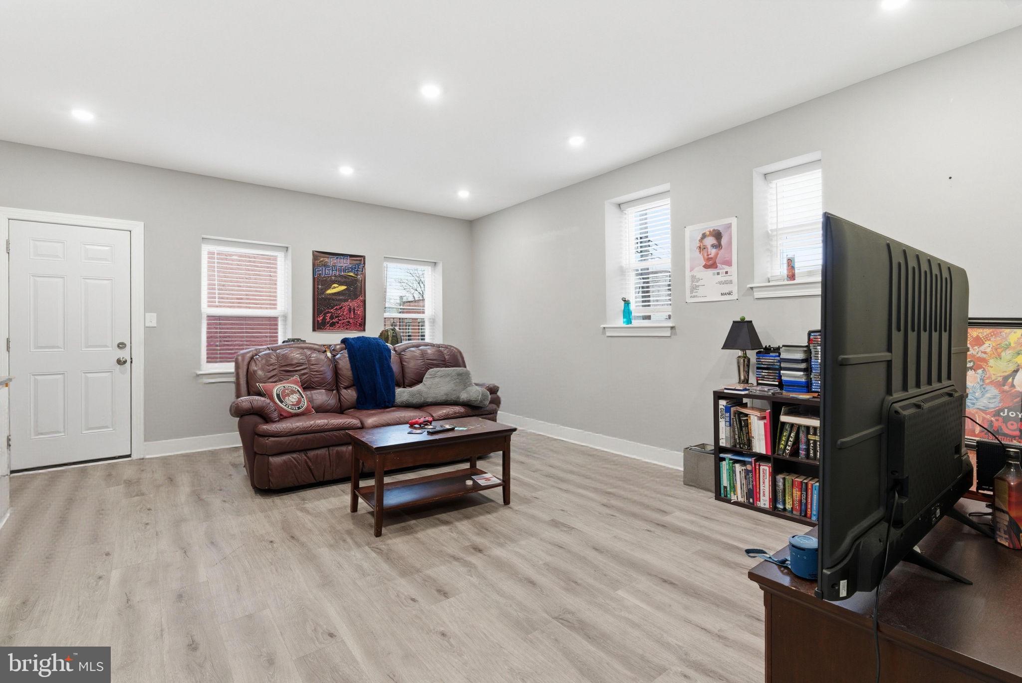 1813 South 23rd Street Philadelphia, PA 19145 - Photo 19 of 23 a living room with furniture and a flat screen tv
