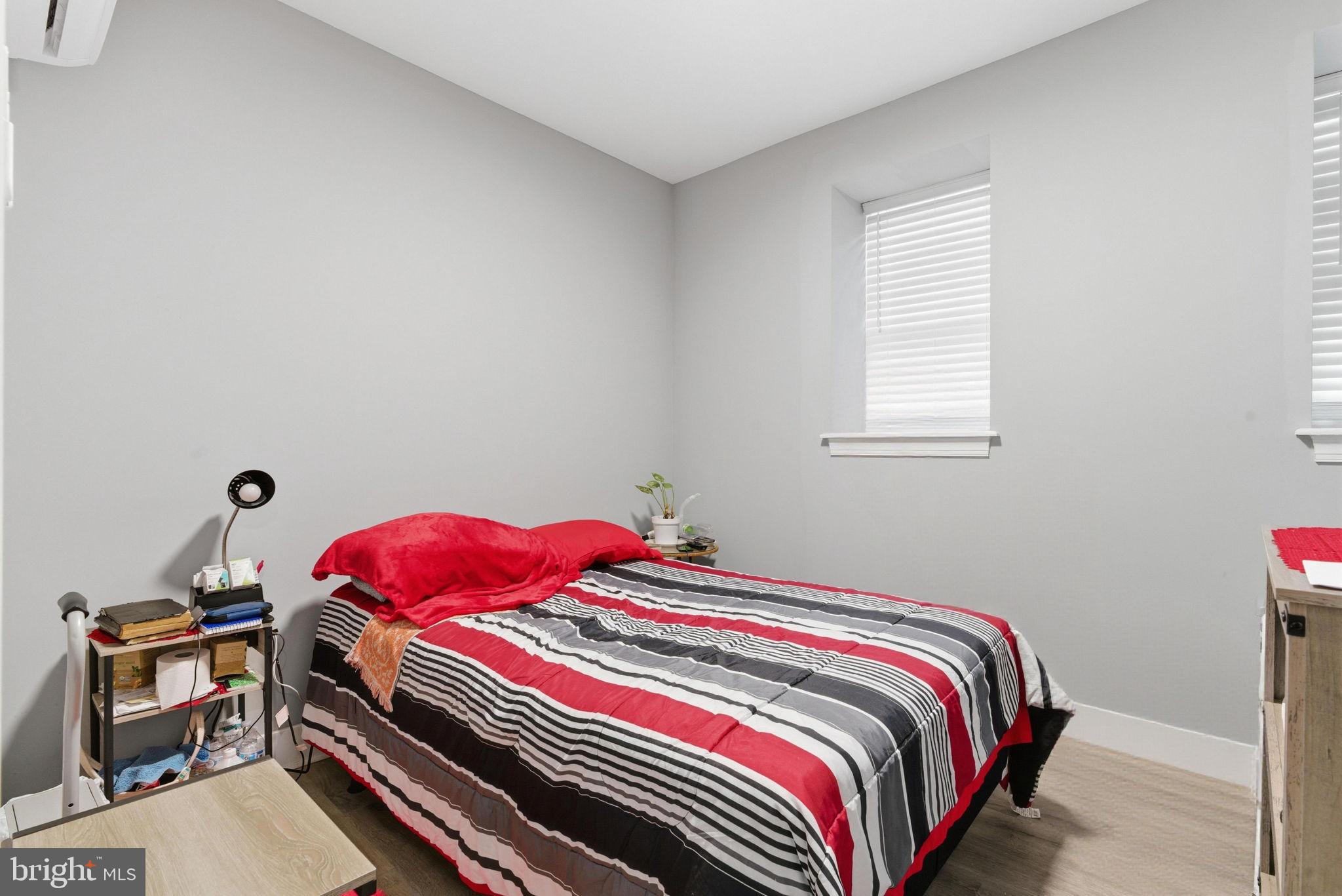 1813 South 23rd Street Philadelphia, PA 19145 - Photo 6 of 23 a bedroom with a bed and a window