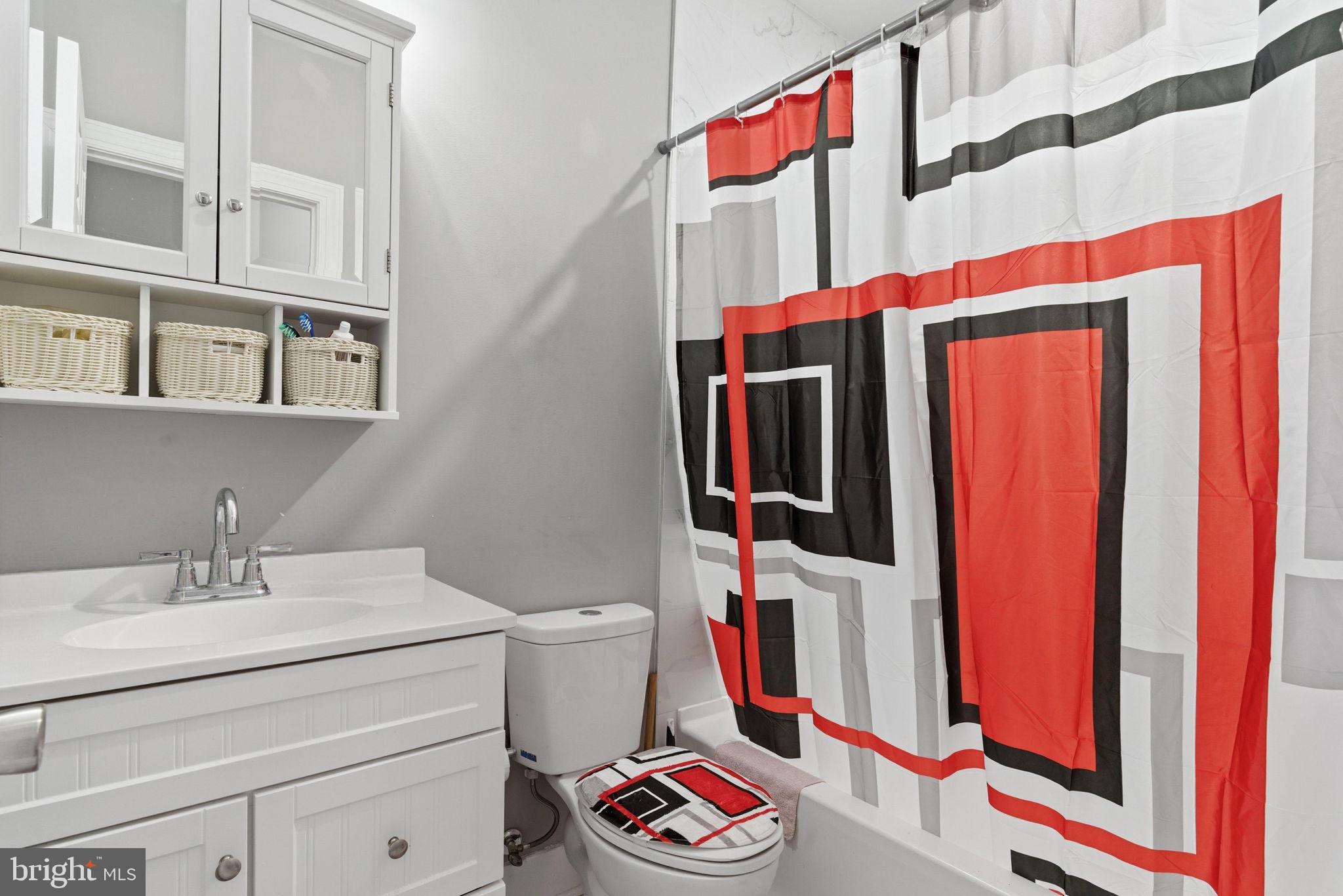 1813 South 23rd Street Philadelphia, PA 19145 - Photo 7 of 23 a bathroom with a sink and a mirror