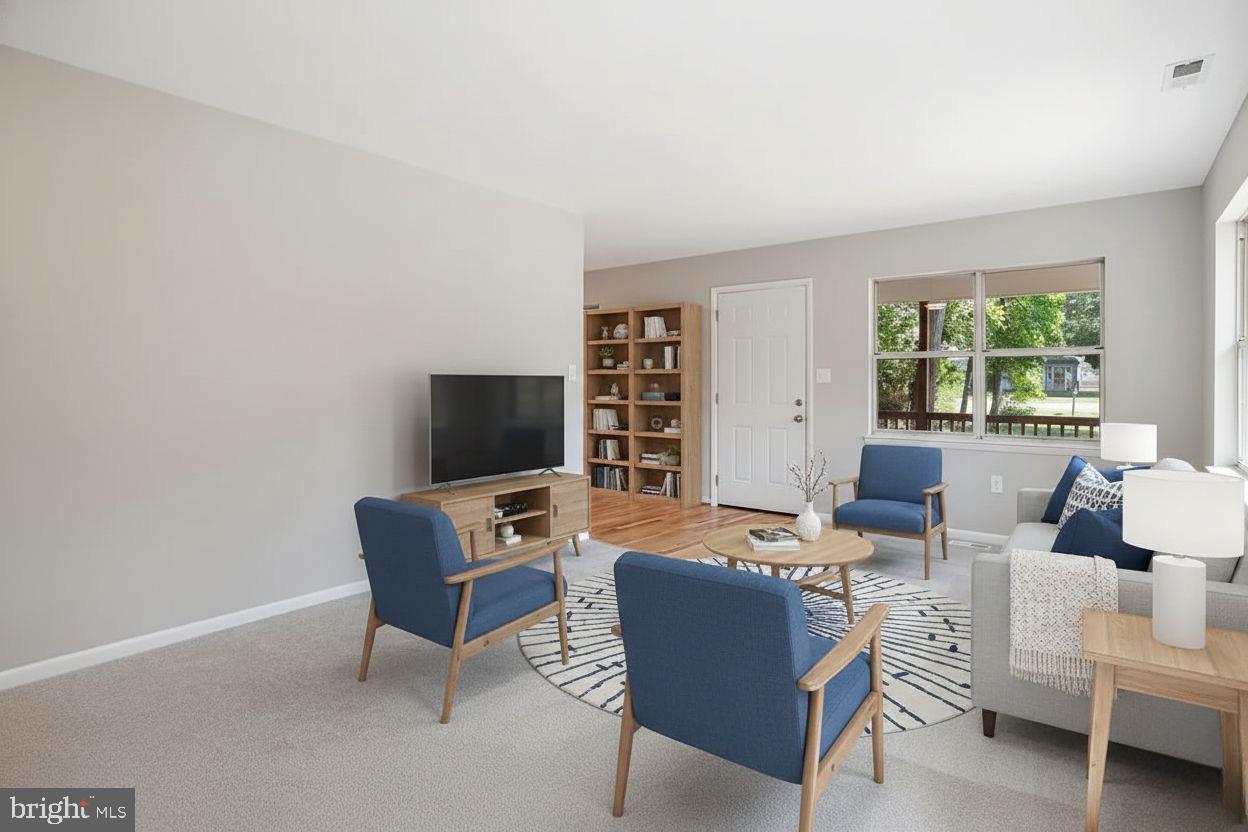 251 Cape St John Road Annapolis, MD 21401 - Photo 14 of 61 a living room with furniture and a flat screen tv