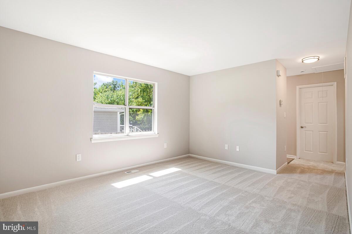 251 Cape St John Road Annapolis, MD 21401 - Photo 18 of 61 a view of an empty room with a window