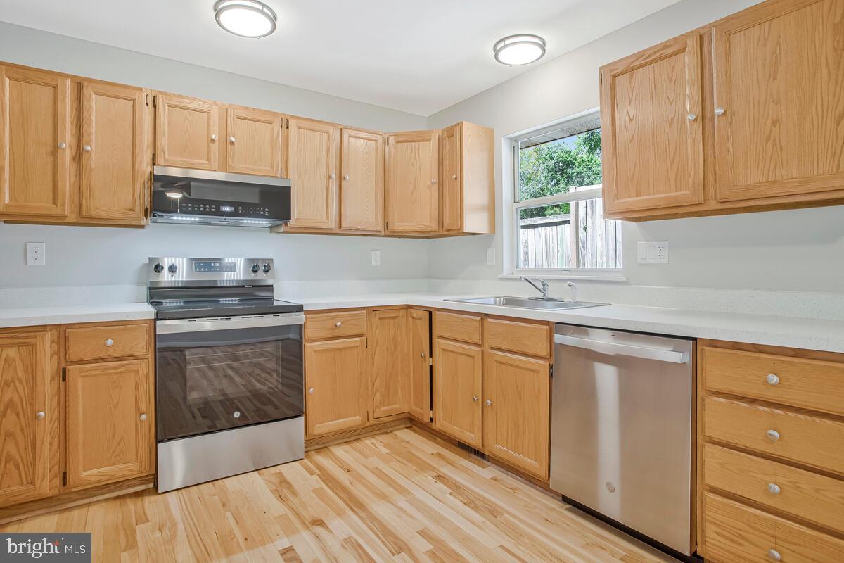 251 Cape St John Road Annapolis, MD 21401 - Photo 26 of 61 a kitchen with granite countertop stainless steel appliances white cabinets granite counter tops and a window
