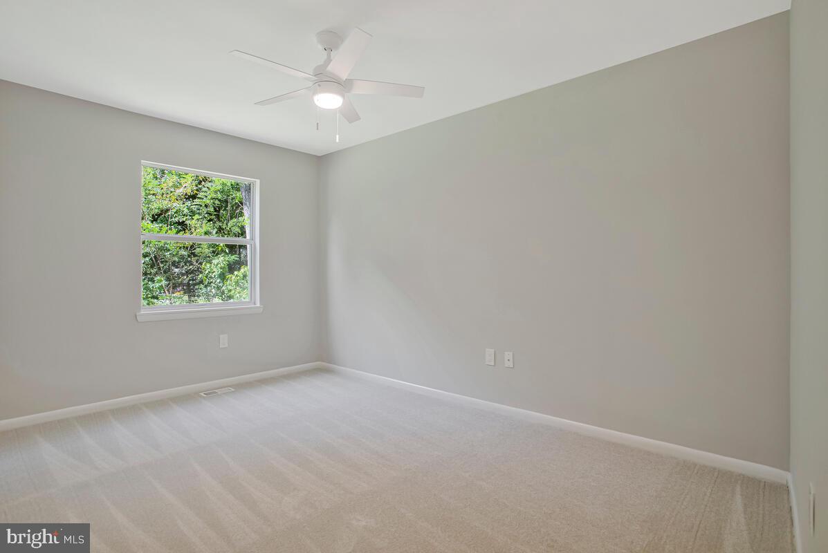 251 Cape St John Road Annapolis, MD 21401 - Photo 29 of 61 an empty room with a window and a fan