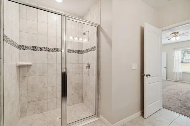 a bathroom with a glass shower door