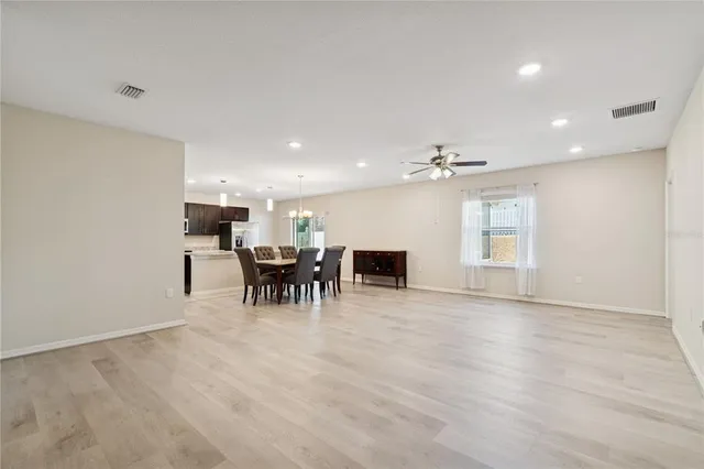 an empty room with furniture and fireplace