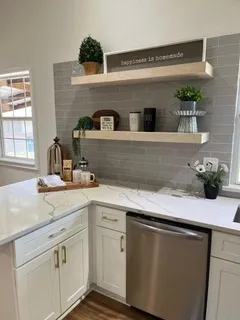 a kitchen with a sink and cabinets