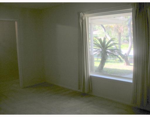124 Fulton Place Portland, TX 78374 - Photo 2 of 8 a view of an empty room and window