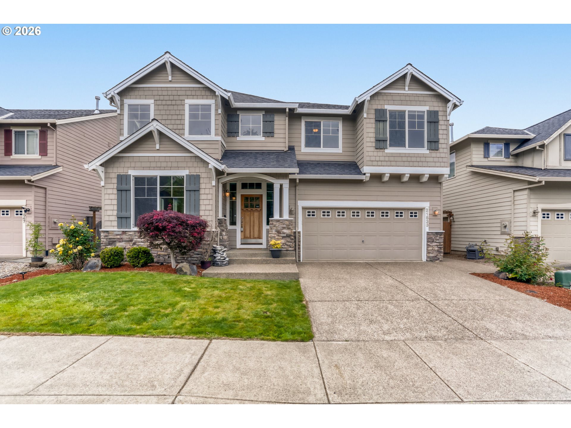 21533 Southwest Susan Lane Beaverton, OR 97003 - Photo 2 of 31 a front view of a house with a yard