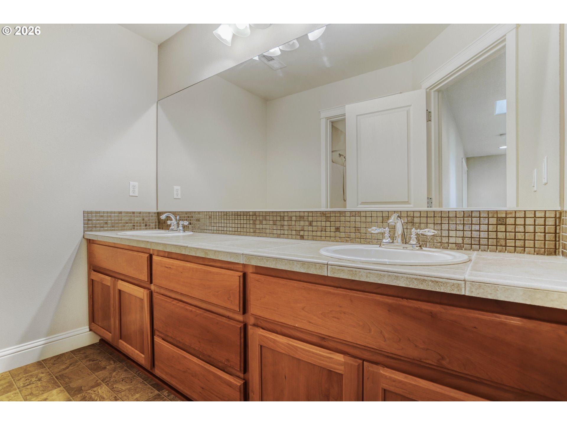 21533 Southwest Susan Lane Beaverton, OR 97003 - Photo 24 of 31 a bathroom with a sink and a mirror