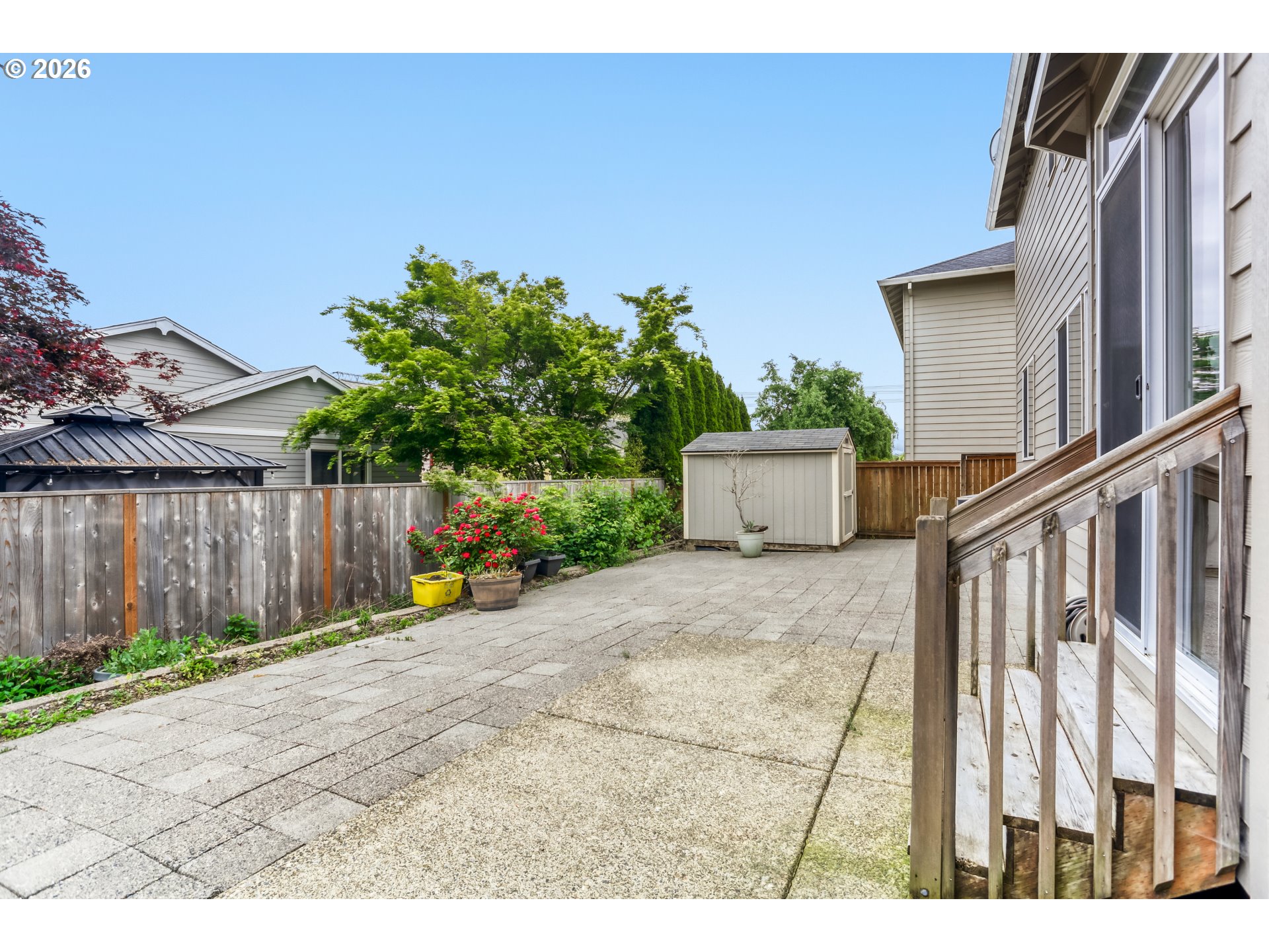 21533 Southwest Susan Lane Beaverton, OR 97003 - Photo 26 of 31 a backyard of a house with table and chairs
