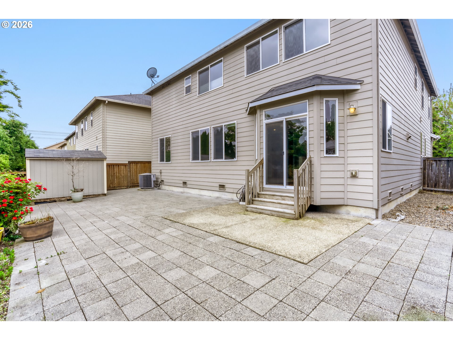 21533 Southwest Susan Lane Beaverton, OR 97003 - Photo 27 of 31 a view of a white house with a outdoor space