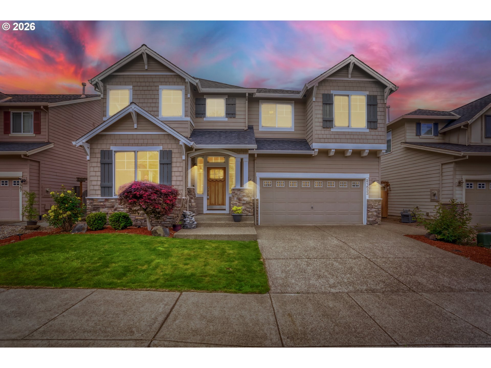 21533 Southwest Susan Lane Beaverton, OR 97003 - Photo 28 of 31 a front view of a house with a yard and garage