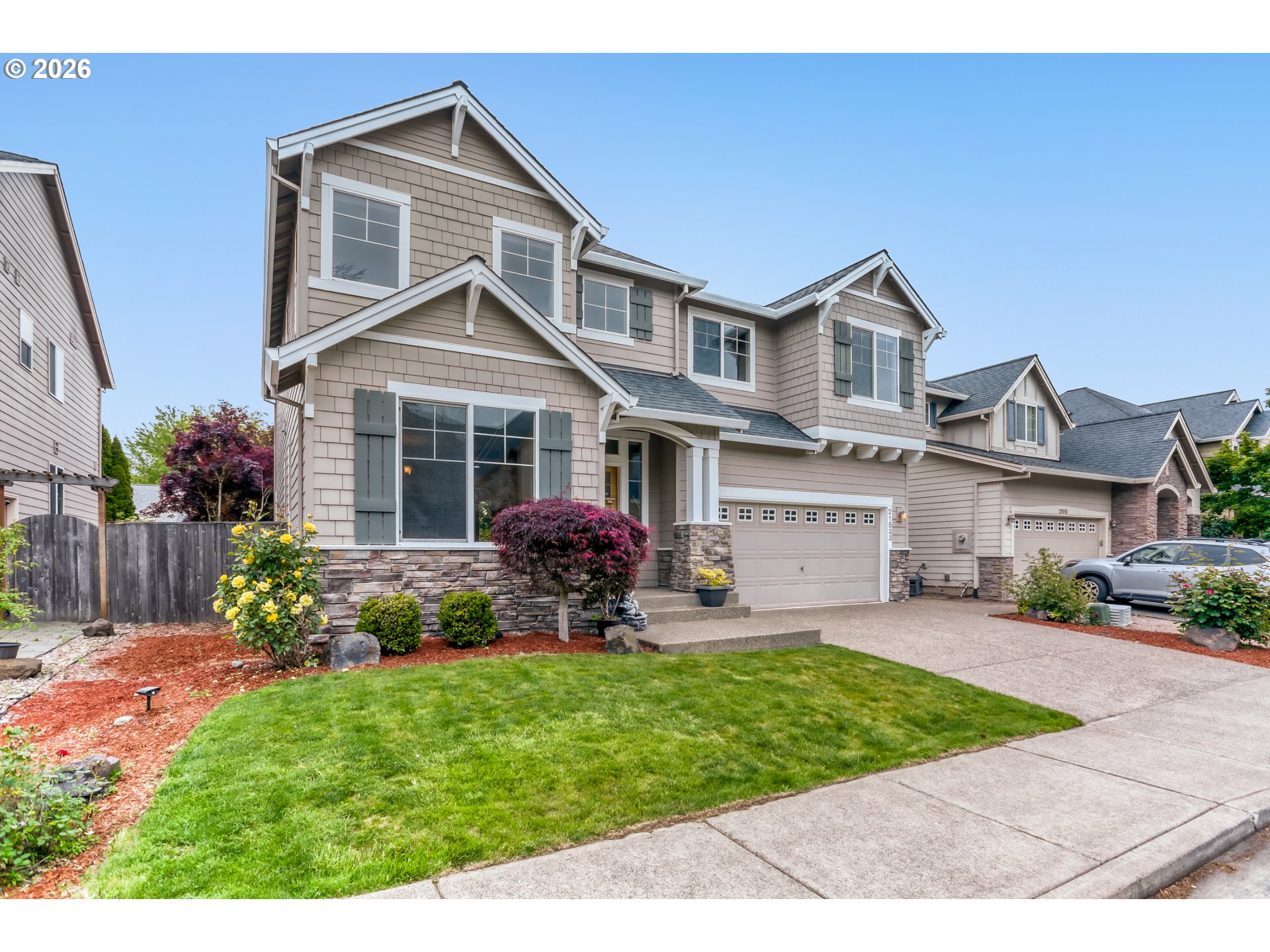 21533 Southwest Susan Lane Beaverton, OR 97003 - Photo 3 of 31 a front view of a house with a garden and plants